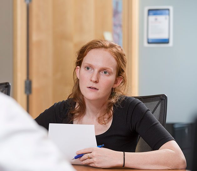 Woman focused at conference table