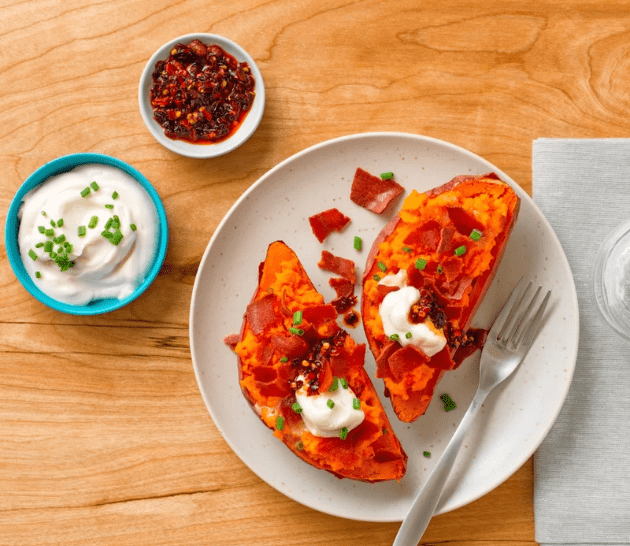 Loaded Sweet Potatoes with Chili Crisp Crema