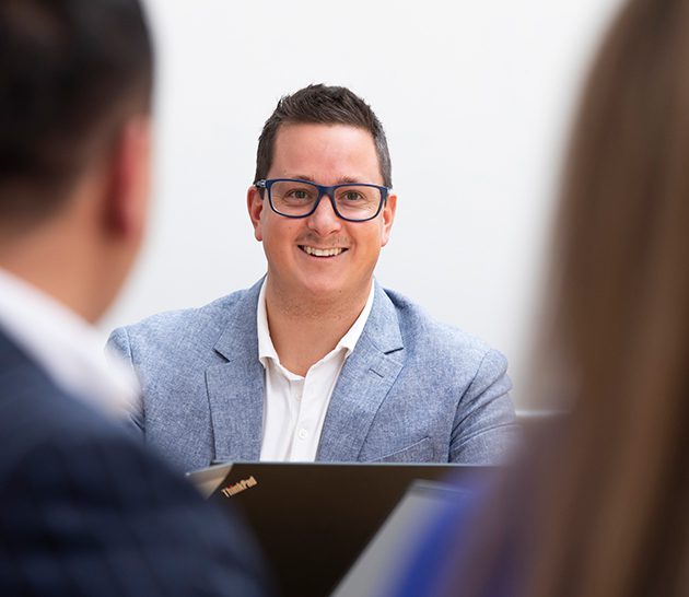 Michael speaking with Team Members